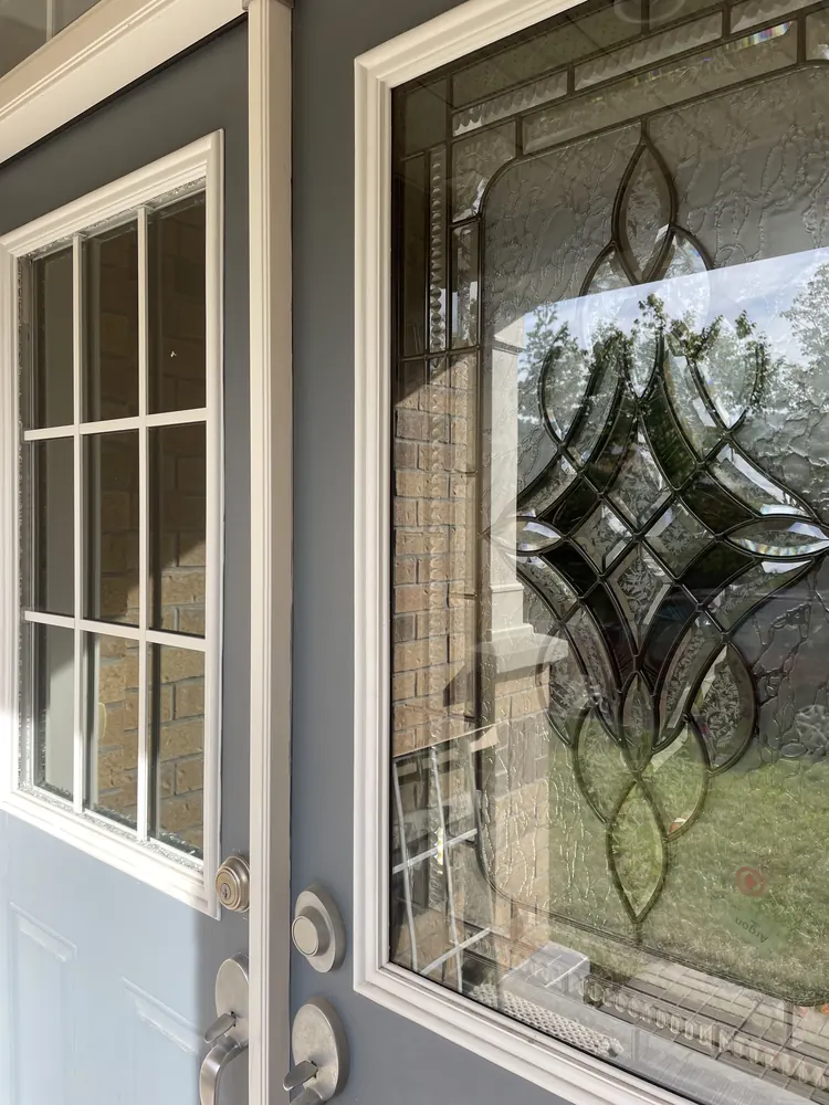Old clear door glass on the left beside new tempered decorative glass on the right, Ottawa