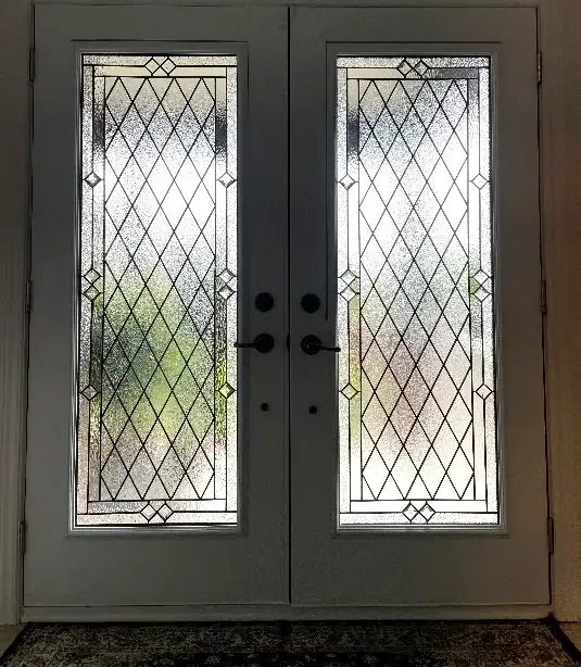 Solid front door cut open for a new glass insert in Ottawa