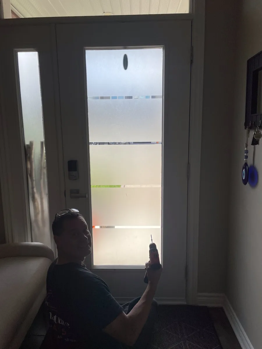 Front door in Ottawa with plain glass before a glass replacement